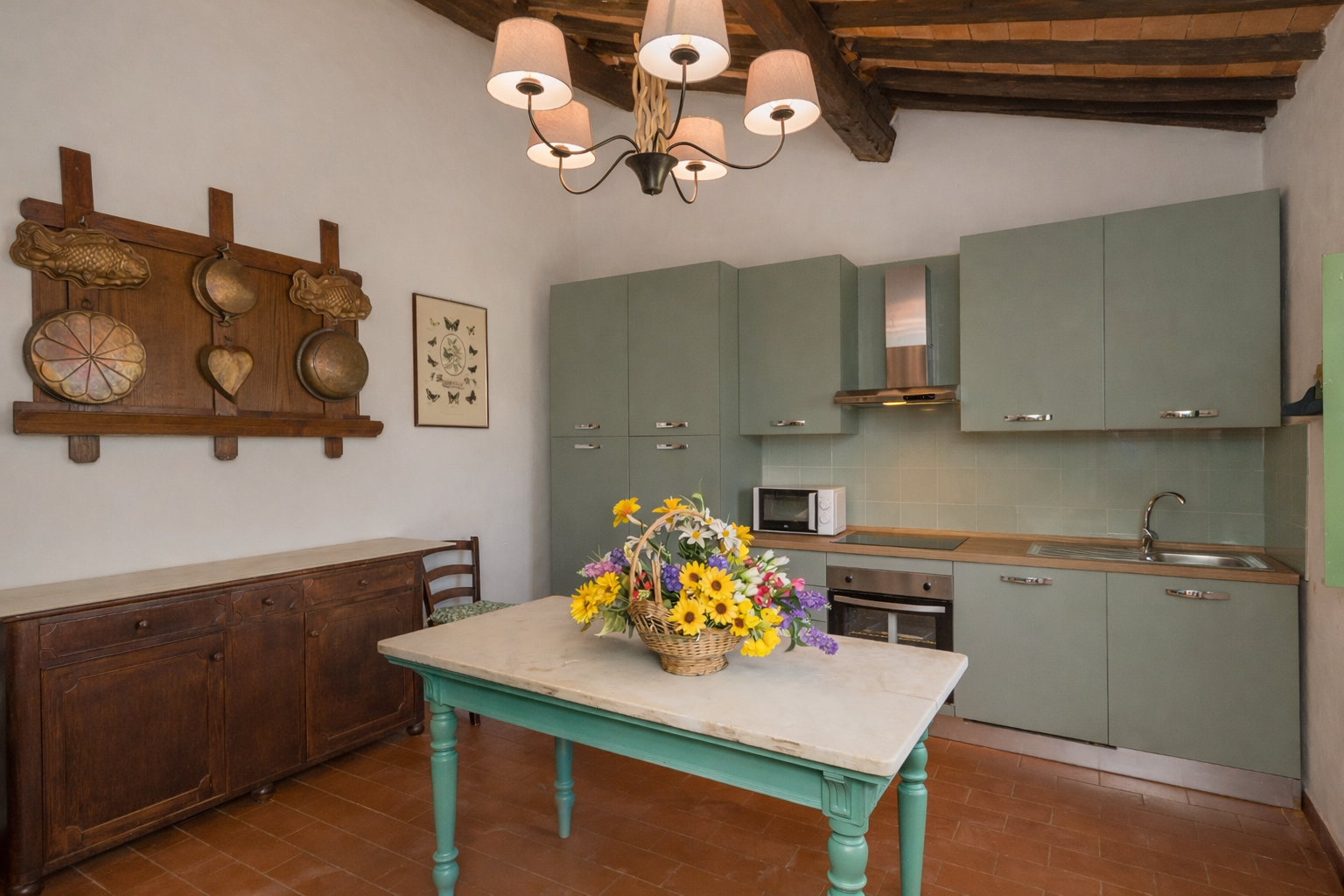 Cucina con archi in pietra appartamento Glicine - La Vivaldina agriturismo Suvereto